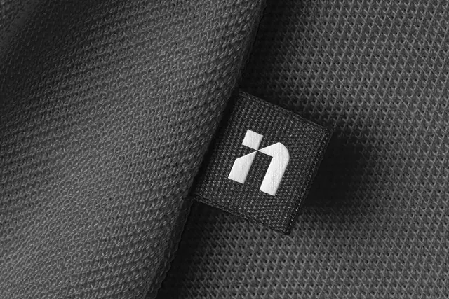 Minimalist logo on textured fabric, minimal, monochrome, monochrome