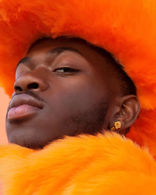 Man in Orange Fur Hood, photographic, luxury, vibrant
