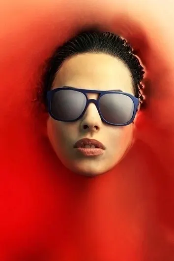Woman in Sunglasses with Red Background, photographic, minimal, vibrant