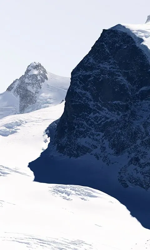 Alpine peak with snow and shadow chiaroscuro, photographic, technical, light