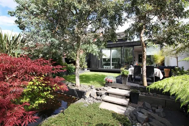 Modern Garden House with Outdoor Seating, photographic, organic, earthy