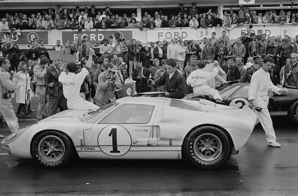 Vintage Racing Car and Crowd Scene, photographic, retro, high-contrast