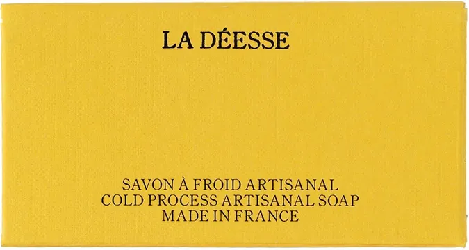 Artisanal soap packaging with serif branding, minimal, luxury, warm