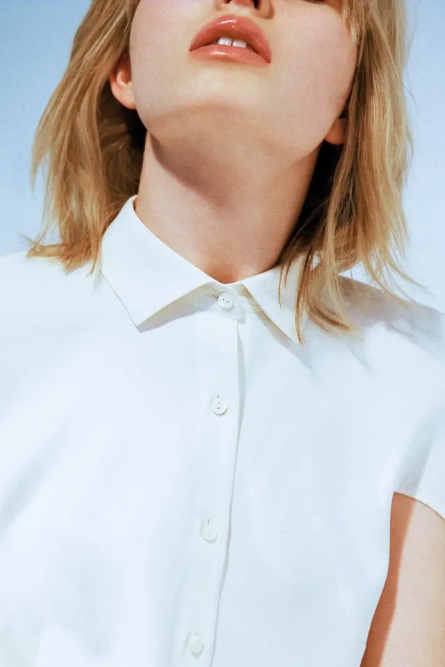 Close-up Portrait of a Woman in a White Shirt, minimal, photographic, light