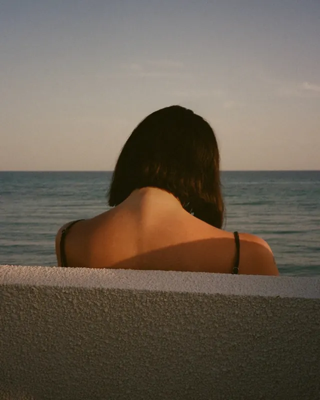 Woman Looking at Ocean, minimal, photographic, muted