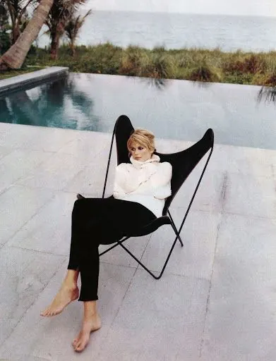 Woman Relaxing in Poolside Chair, photographic, minimal, light