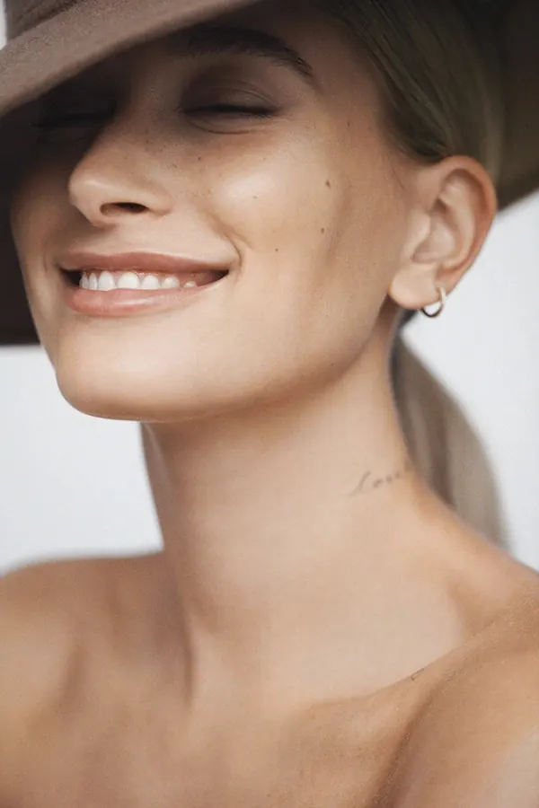 Close-up Portrait of a Smiling Woman, photographic, organic, warm