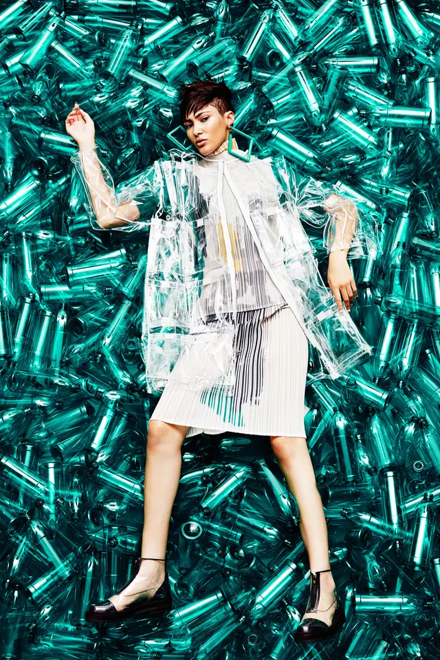 Fashion Model in Abstract Blue Background, photographic, maximalist, vibrant