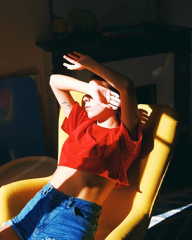 Woman in Red Top and Denim Shorts, photographic, retro, vibrant