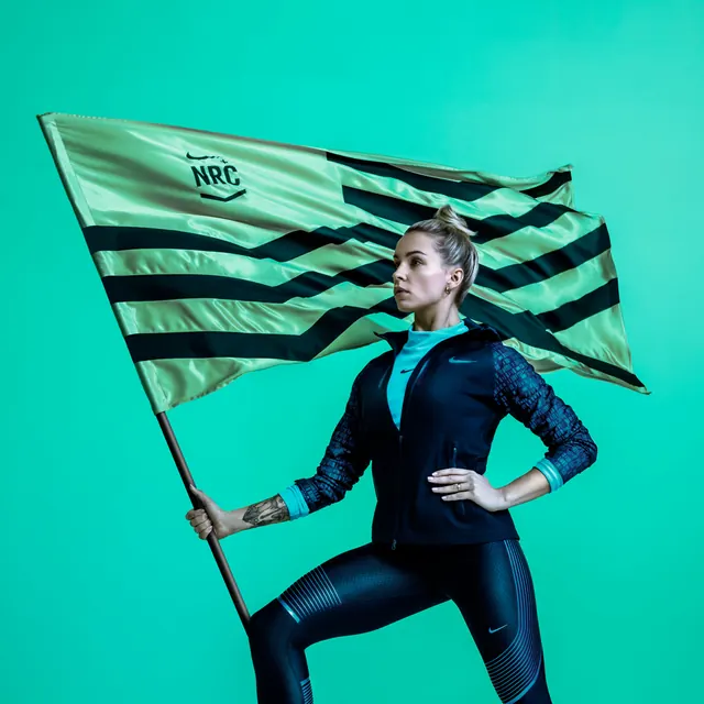 Woman in Futuristic Suit Holding Flag, photographic, technical, vibrant