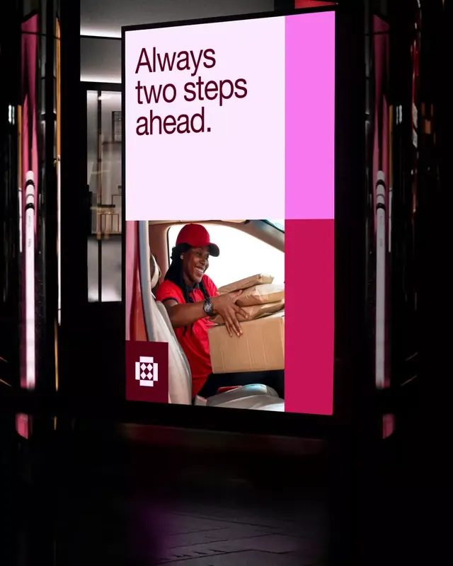 High-contrast magenta and dark billboard with delivery worker, photographic, dark