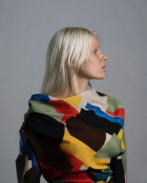 Woman in Abstract Patterned Sweater, photographic, abstract, vibrant