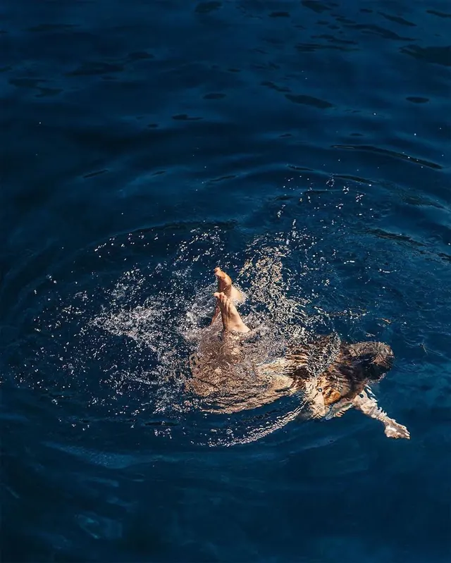 Swimmer in Deep Blue Water, photographic, organic, cool