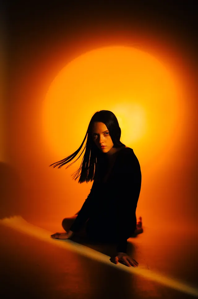 Woman in Silhouette with Glowing Halo, minimal, photographic, warm