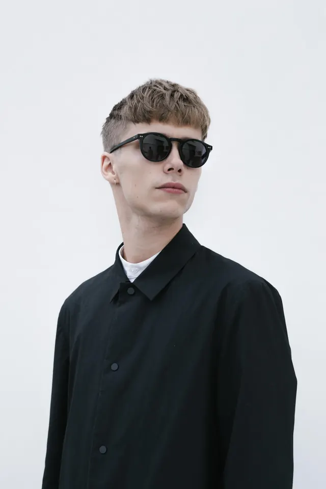 Male Model in Black Shirt and Sunglasses, minimal, photographic, monochrome