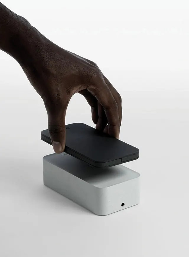 Hand Interacting with Sleek Hardware Mockup, minimal, photographic, dark