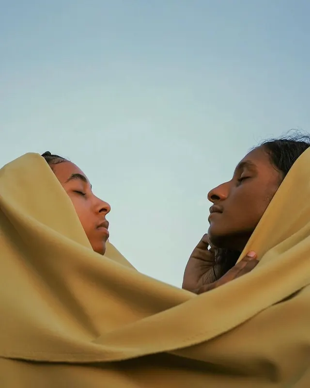 Two People Wrapped in Fabric, photographic, minimal, warm