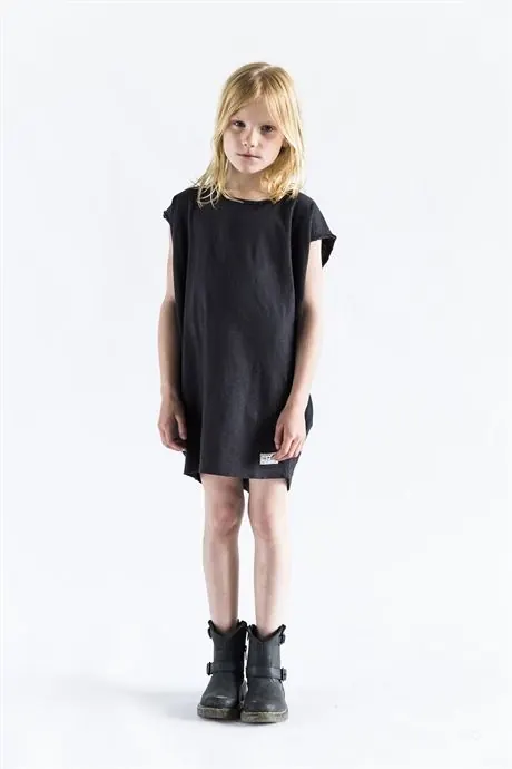 Child in Black T-Shirt and Boots, minimal, photographic, monochrome