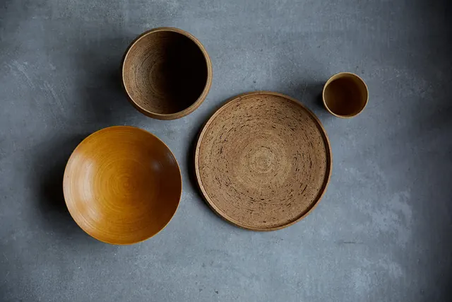 Ceramic Bowls on Textured Surface, minimal, organic, muted