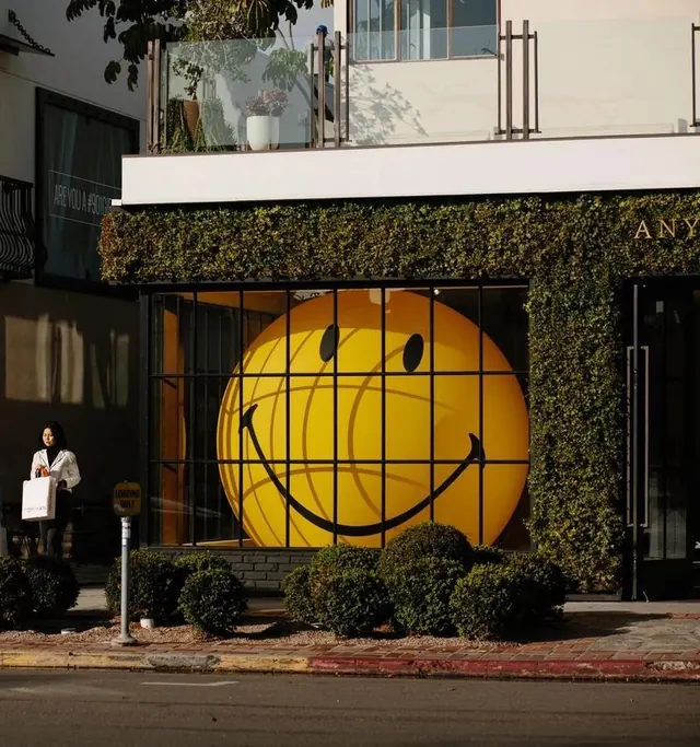 Yellow Smiley Face Building Mockup, playful, photographic, vibrant