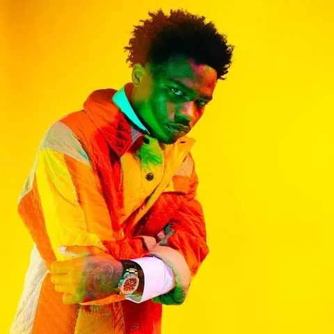 Portrait of a Man in Vibrant Yellow and Orange, photographic, vibrant