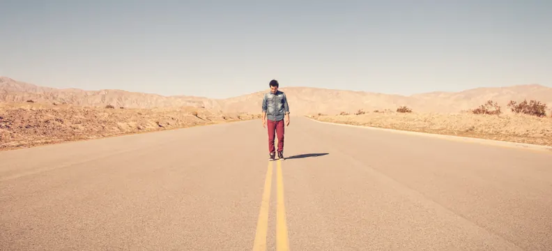 Person Standing on Desert Road, minimal, photographic, warm