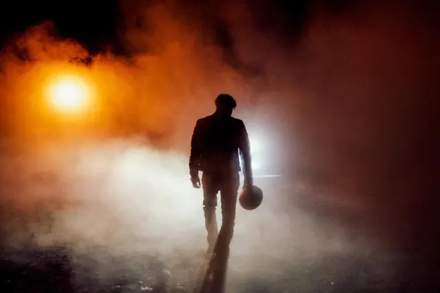 Silhouette in Fog with Glowing Light, photographic, dark-mode, dark