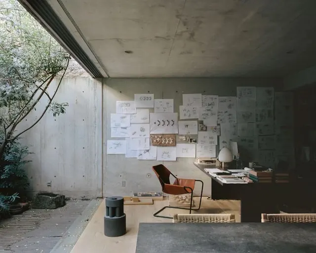 Industrial Studio Workspace with Graphic Wall, minimal, brutalist, muted
