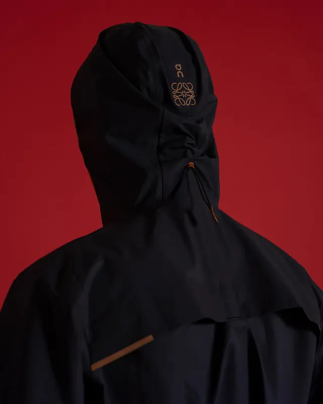 Hooded Garment with Circular Logo, minimal, luxury, high-contrast