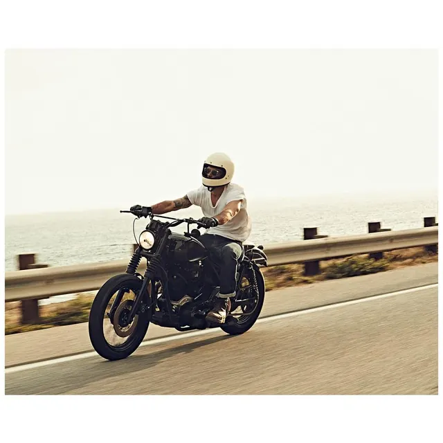 Motorcyclist on Coastal Road, minimal, photographic, light