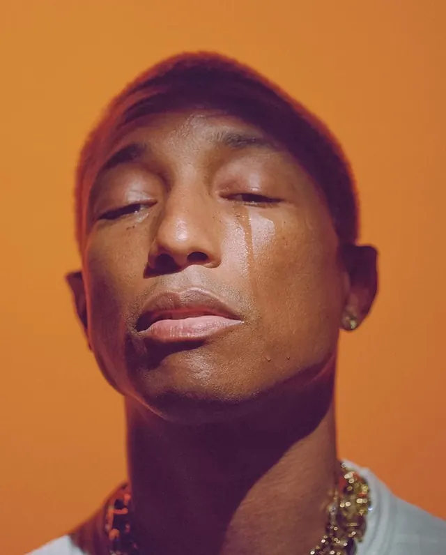 Close-up Portrait of a Man with Beads, photographic, warm