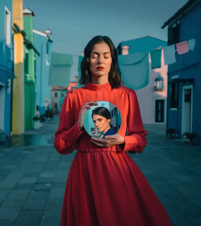 Woman in Red Dress Holding Portrait, photographic, maximalist, vibrant