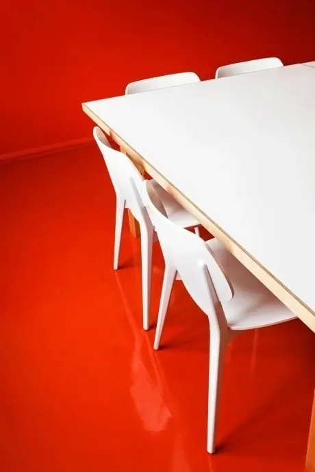 Minimalist White Chairs and Table on Red Background, minimal, geometric, vibrant