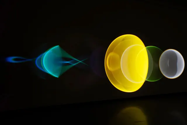 Abstract Glowing Orbs and Rings, dark-mode, gradient-heavy, dark