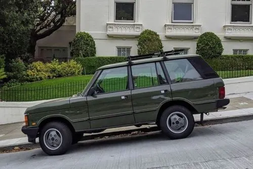Green SUV in Urban Setting, photographic, earthy
