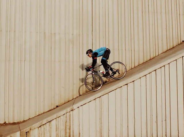 Bicyclist on Ramp, minimal, photographic, warm
