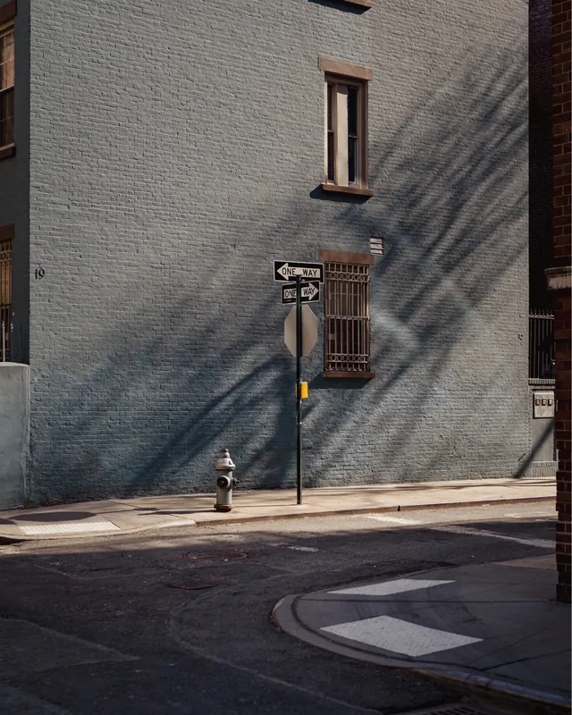 Street Signage on Textured Wall, photographic, minimal, muted