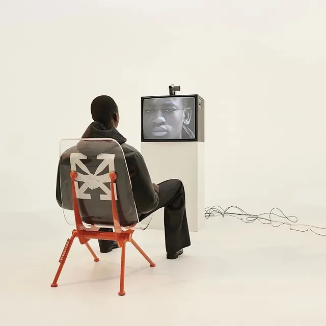 Man Watching TV in Minimalist Setting, minimal, photographic, monochrome