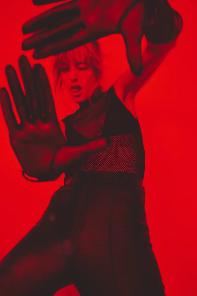 Red-Toned Portrait with Hand Gesture, photographic, maximalist, vibrant