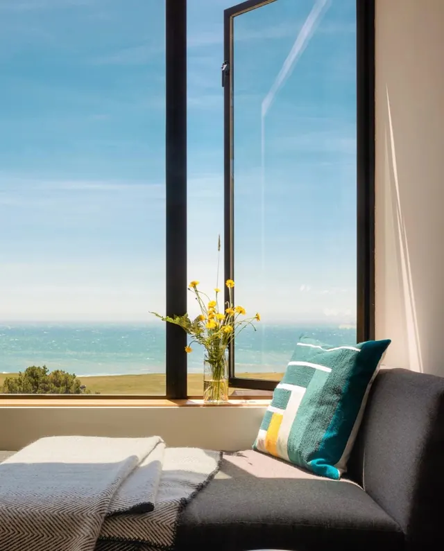 Interior View of Beachfront Room with Pillows, minimal, photographic, light