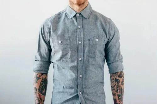 Man in Denim Shirt with Tattoos, photographic, minimal, muted
