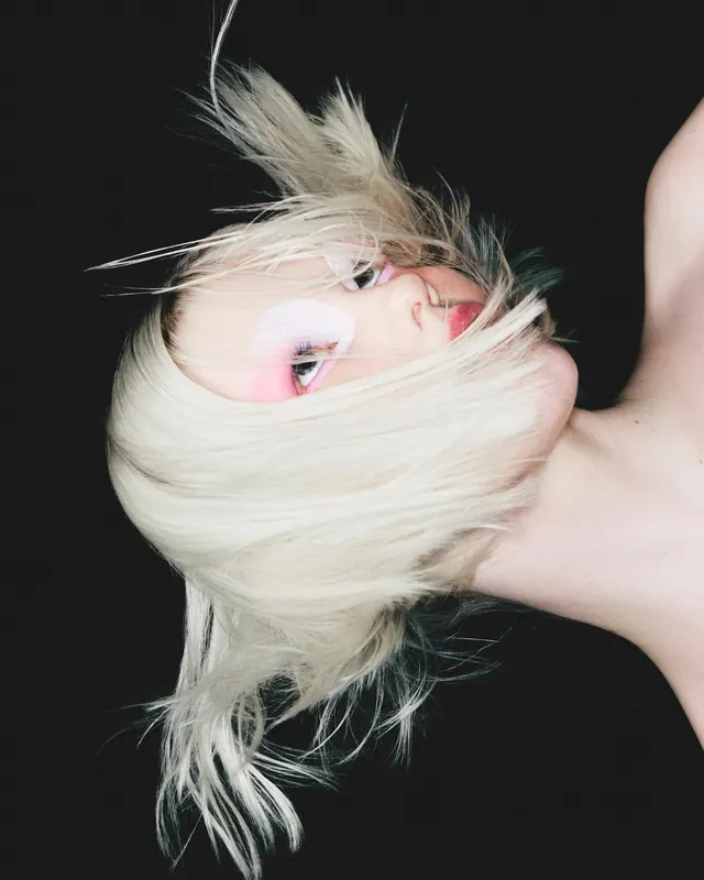 Close-up Portrait of a Person with Platinum Blonde Hair, photographic, minimal, high-contrast