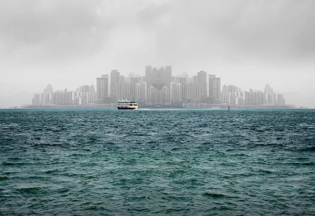 Cityscape over Water with Boat, photographic, minimal, muted