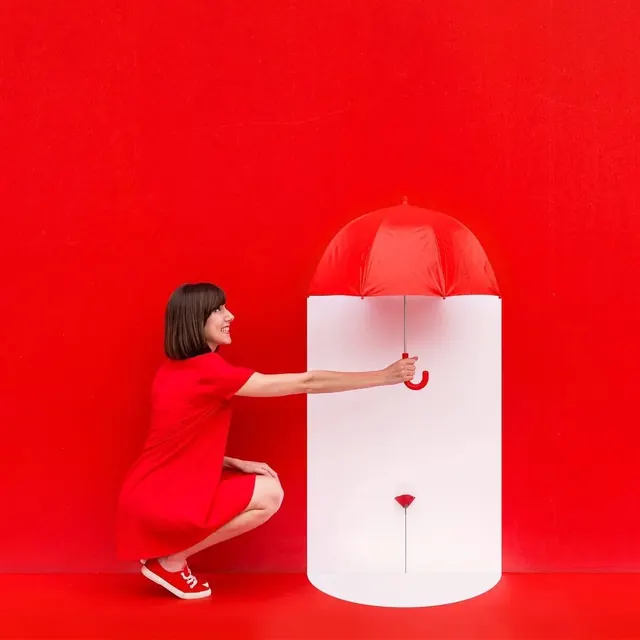 Woman with Umbrella in Red and White Space, minimal, photographic, vibrant