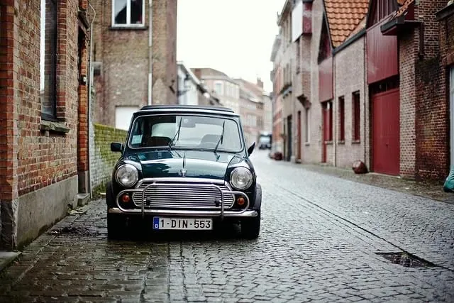 Vintage Fiat 500 on Cobblestone Street, photographic, retro, warm