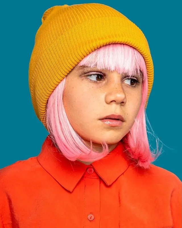 Portrait of a Person in a Yellow Beanie, photographic, playful, vibrant