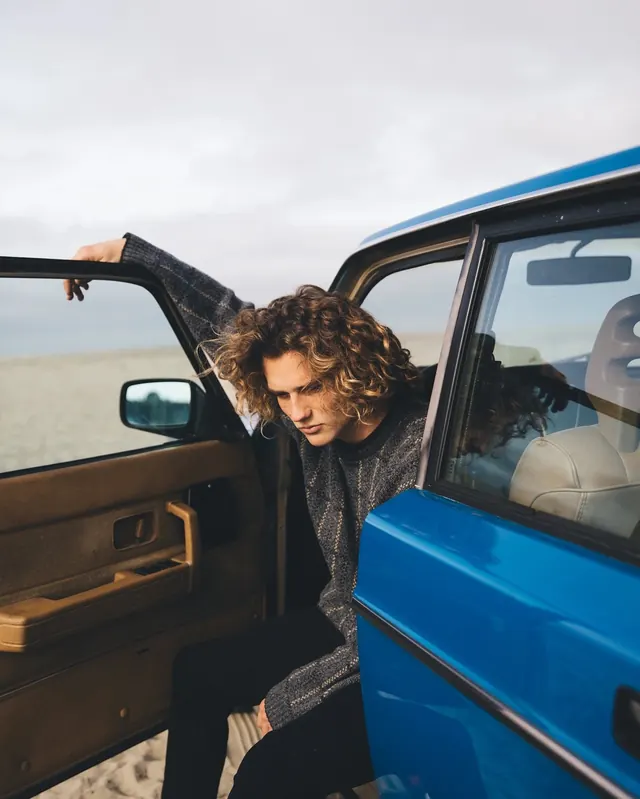 Woman in Blue Vehicle, photographic, organic, vibrant