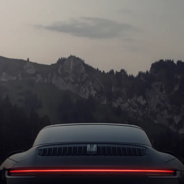 Luxury Car Rear View in Mountain Landscape, minimal, luxury, dark