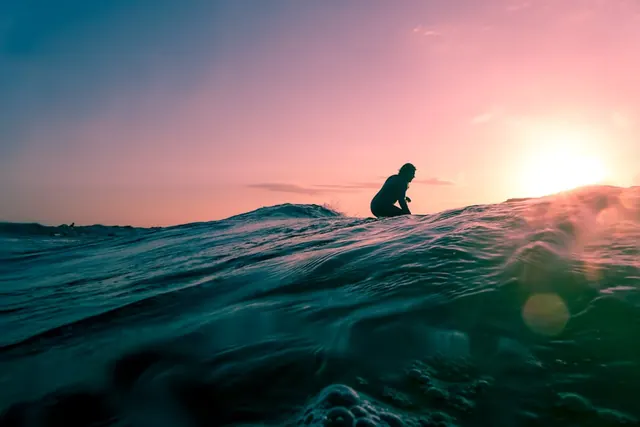 Surfer Silhouette at Sunset, photographic, organic, vibrant
