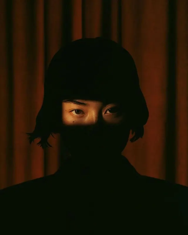 Masked Figure Portrait, dark-mode, photographic, dark